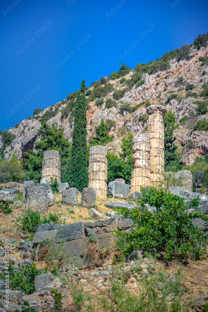 Ancient city of Delphi with ruins of the temple of Apollo, the omfalos (center) of the earth, theater, arena and other buildings, Greece