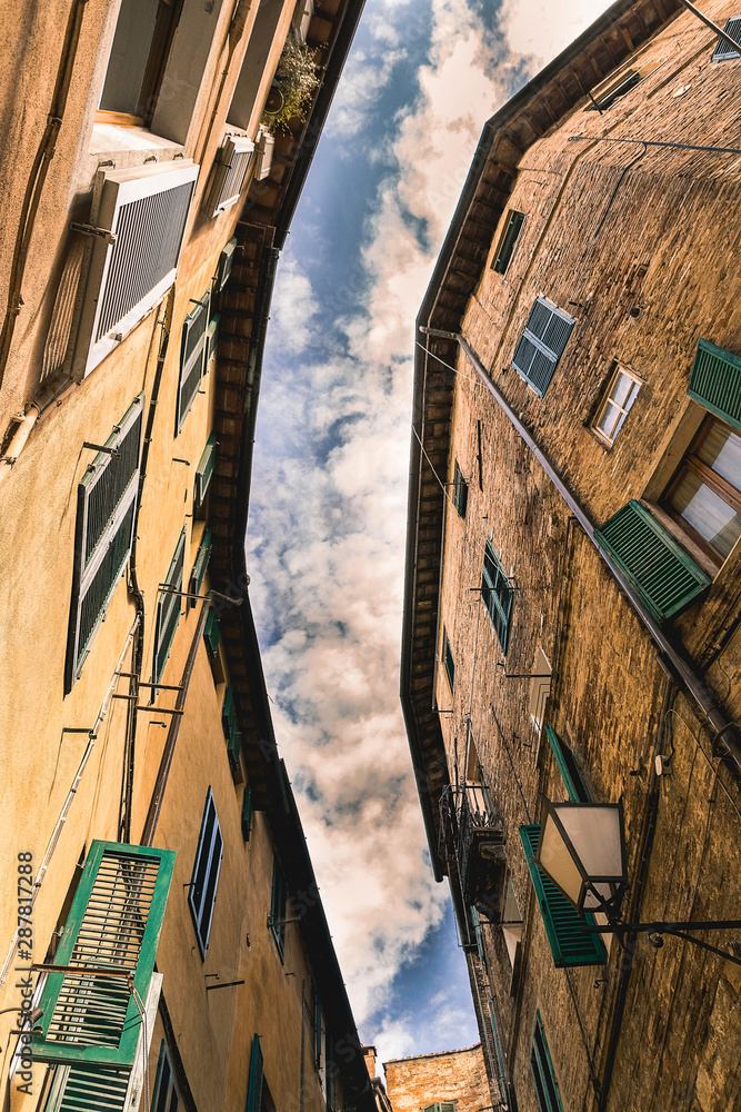 Naklejka premium Typical narrow street of Florence, Italy