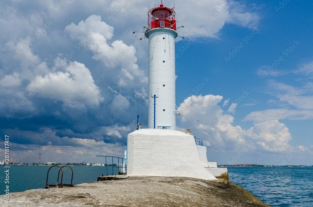 Seascape with lighthouse on the Black Sea in Odesa during the summer season Seascape with lighthouse on the Black Sea in Odesa during the summer season