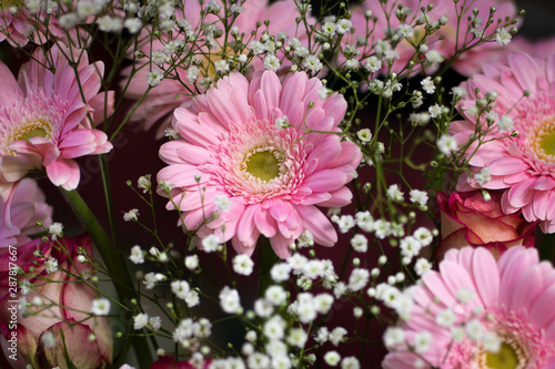 Roses, gerberas and gypsophila combined in a flower arrangement. 6