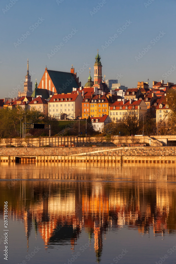 City skyline at sunrise, view across the Vistula River to the Old Town, Warsaw, Poland City skyline at sunrise, view across the Vistula River to the Old Town, Warsaw, Poland