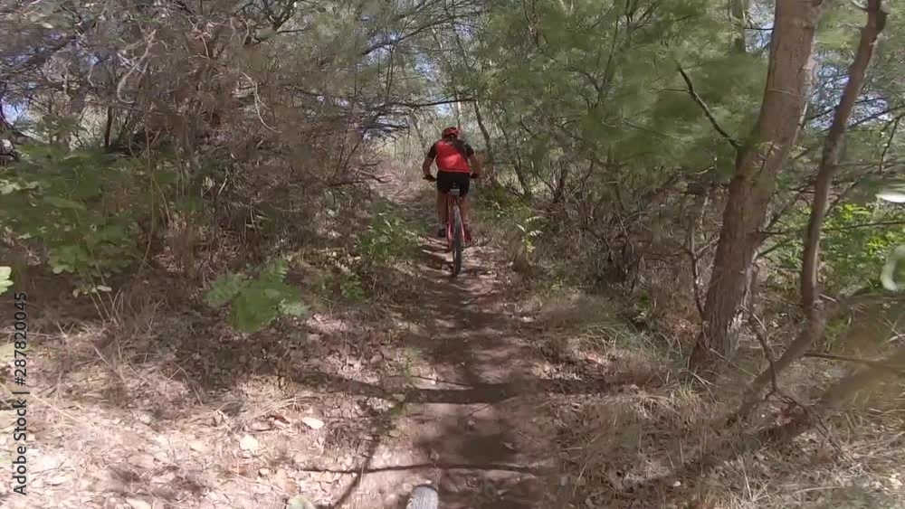 Sport man riding a red mountain bike. Sport man riding a red mountain bike.
