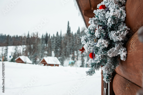 Ready for New year in village house in the forest © olinchuk