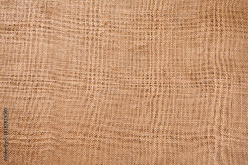 Woven brown horizontal fabric background flat lay from above