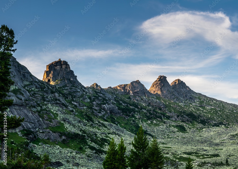 Obraz premium Gorgeous panoramic view on top of western Sayan mountain range during summer sunset in Ergaki national park, Siberia, Russia