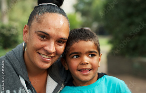 Selective focus of aboriginal boy and woman photo