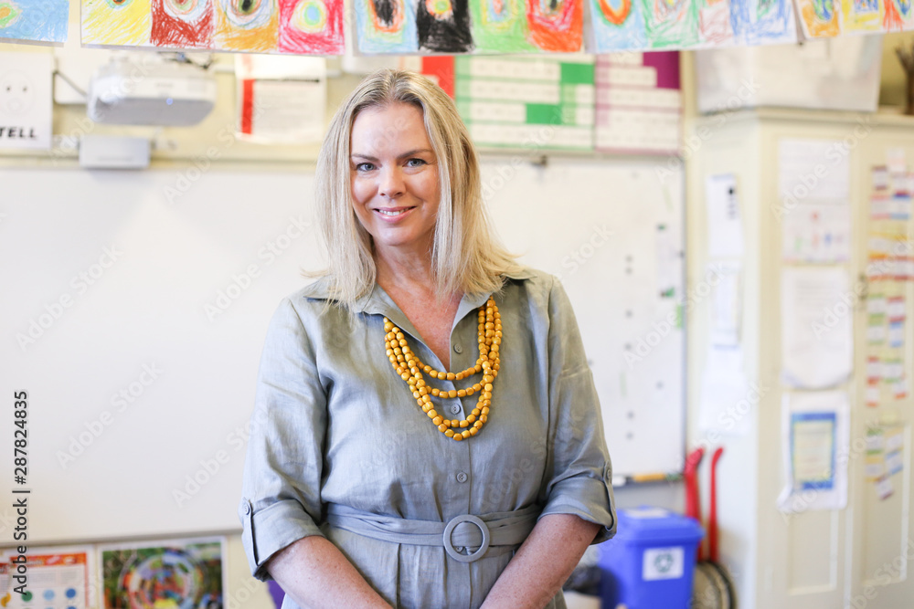Portrait of teacher in classroom Portrait of teacher in classroom