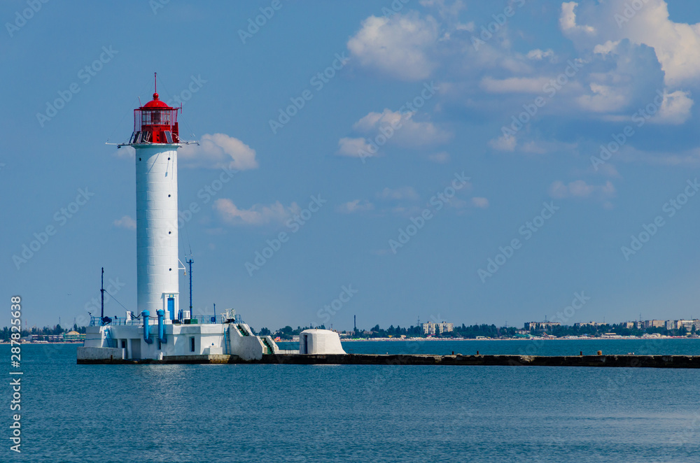 Seascape with lighthouse on the Black Sea in Odesa during the summer season Seascape with lighthouse on the Black Sea in Odesa during the summer season