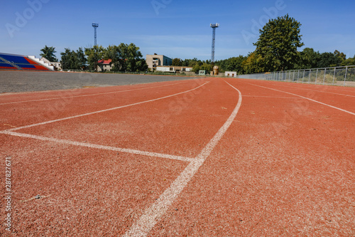 red running track on the athletic stadium. close up