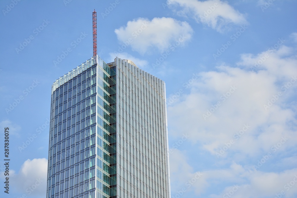 modern office building with reflection in windows