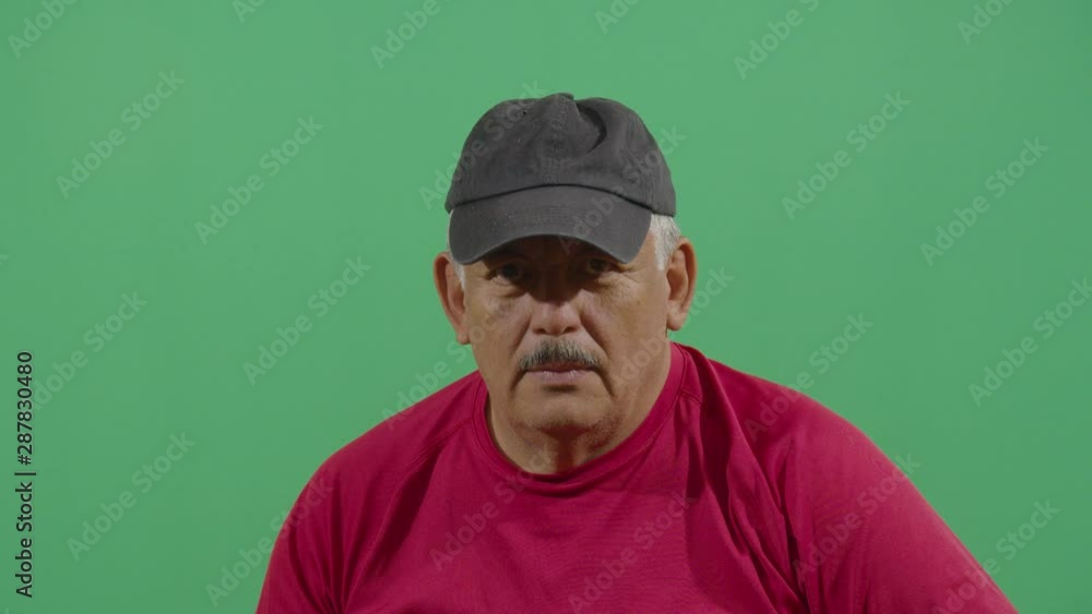 Adult Man Putting On A Sport Cap Adult Man Putting On A Sport Cap