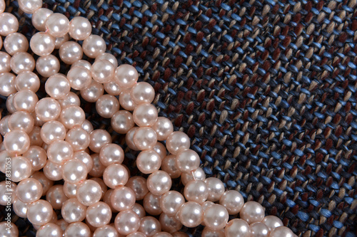 Pearl necklace on the gray background texture