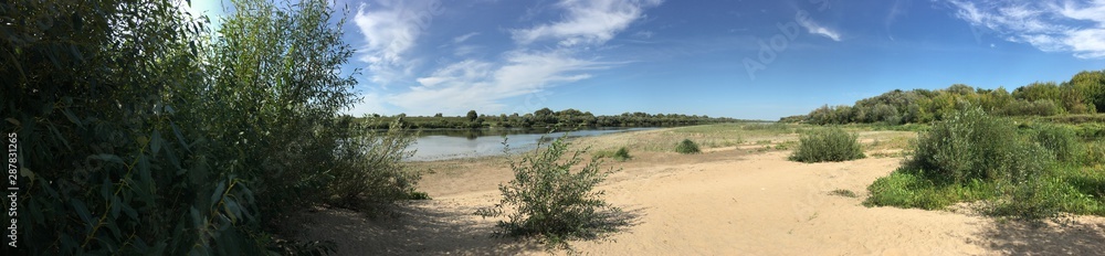 long sandy beach and thickets