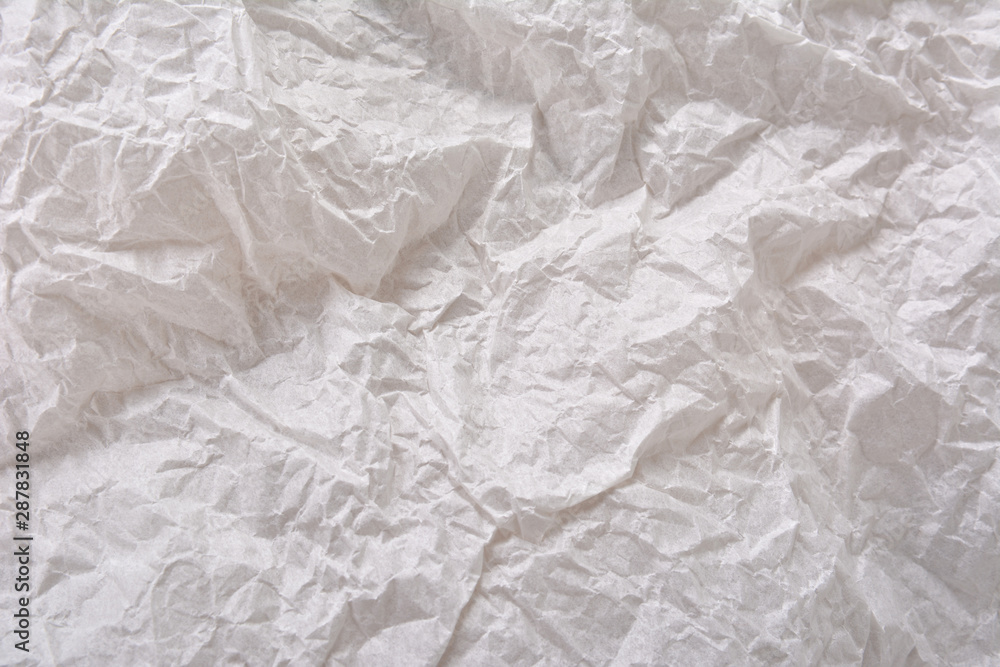 Textured clean sheet of crumpled paper white color empty background Textured clean sheet of crumpled paper white color empty background