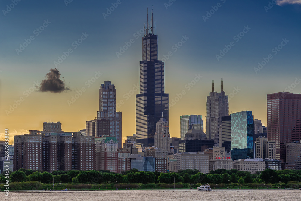Chicago, Illinois / USA  08/18/2019: Dramatic Golden Sunset behind the City of Chicago Skyline.