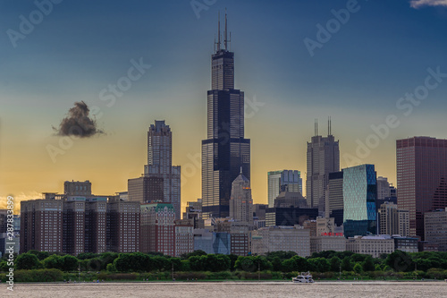 Chicago, Illinois / USA  08/18/2019: Dramatic Golden Sunset behind the City of Chicago Skyline. photo