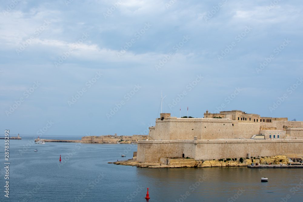 Lanscape near st.Angelo fort on Malta. Blue sea, windows and defenc tower.
