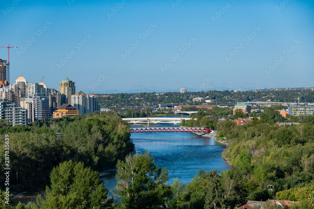 Morning aerial view of the famous red Peace Bridge and downtown cityscape