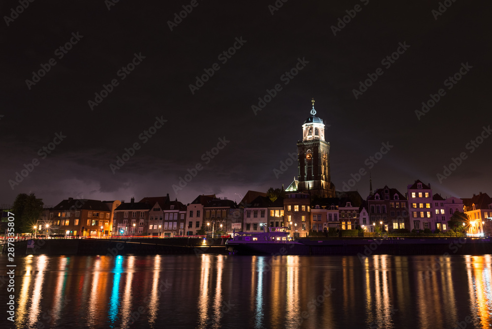 View of the river IJssel and Maria Church in Deventer, Netherlands at night