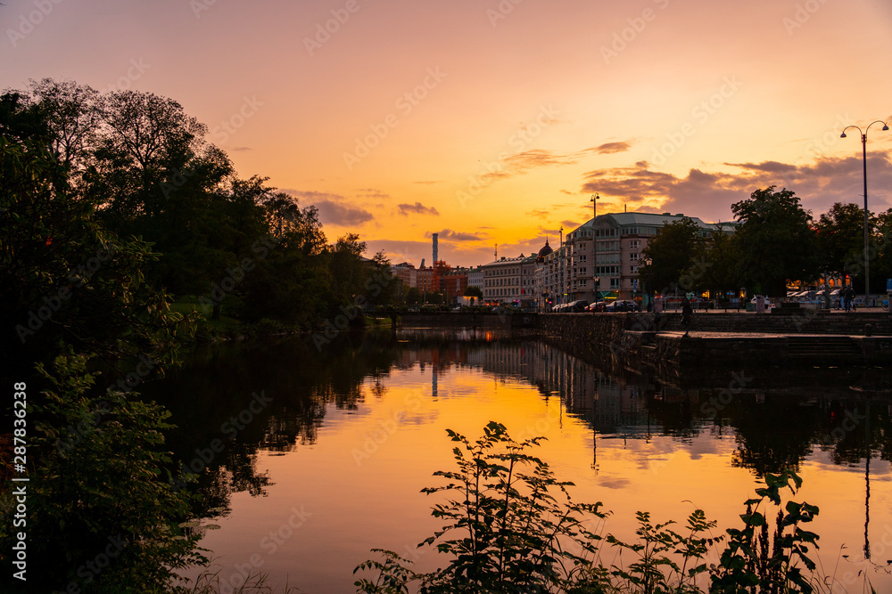 sunset in Goteborg Sweden with the reflection on the river sunset in Goteborg Sweden with the reflection on the river