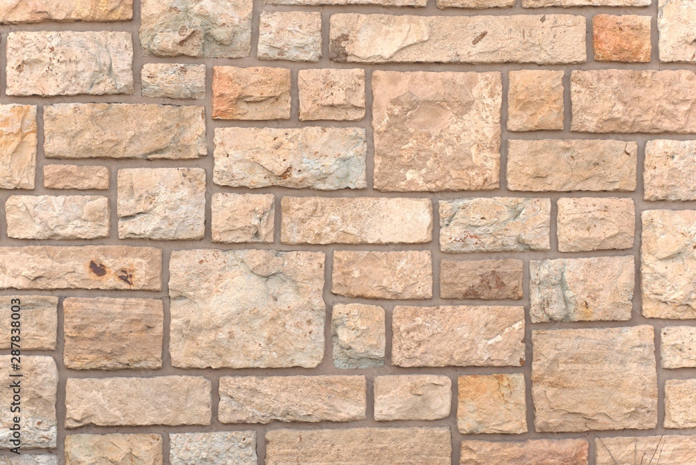 Square stones on a rustic wall. Texture detail. Square stones on a rustic wall. Texture detail.