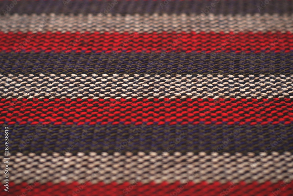Red, gray and white striped wool cloth. Flat texture detail. Red, gray and white striped wool cloth. Flat texture detail.