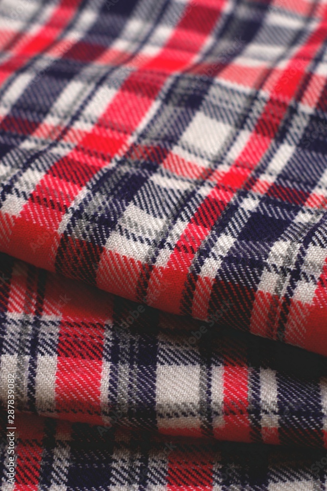 Red, blue and white tartan patterned cloth. Red, blue and white tartan patterned cloth.