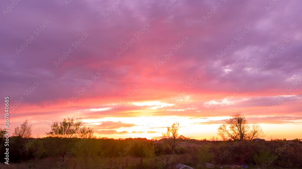 Fototapeta premium Nebraska countryside landscape trees, water, and sky with clouds