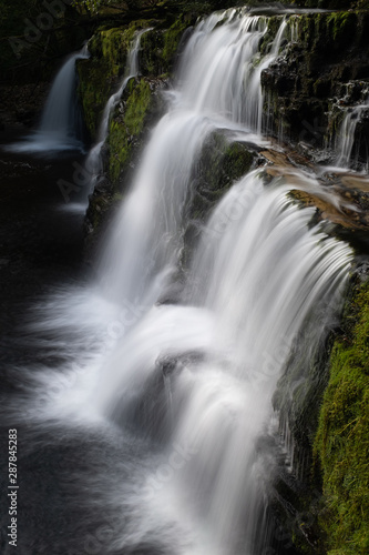 Fototapeta Naklejka Na Ścianę i Meble -  Long exposure shot of waterfall, in the Brecon Beacons, Wales scenic waterfall with flowing water