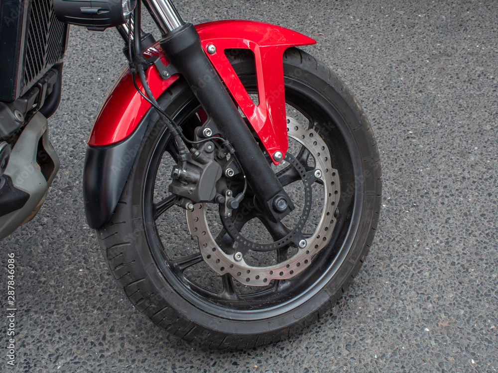 Obraz premium Red and Black Motorbike Wheel - Close Up