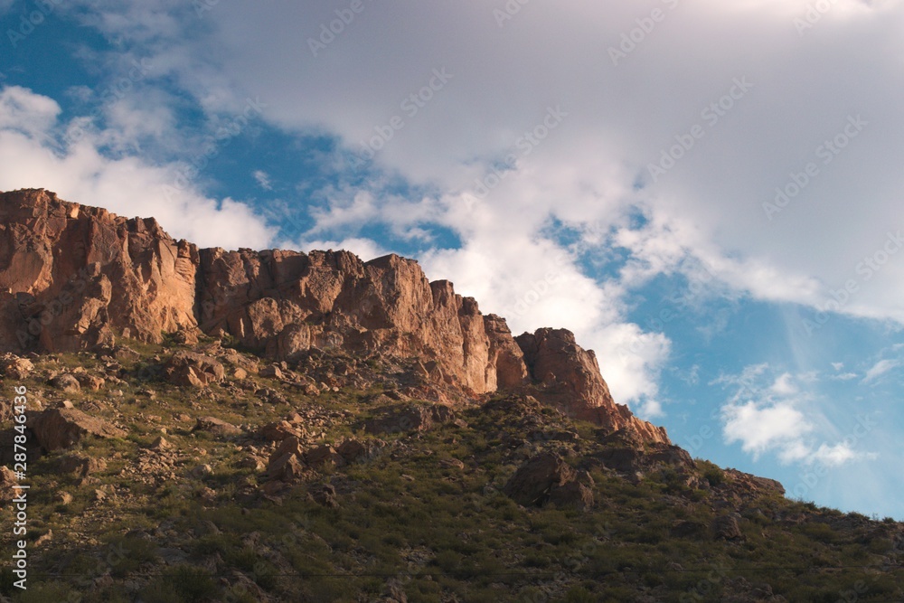 Rocky outcrop against a cloudy sky at sunset, in the province of Mendoza, Argentina.