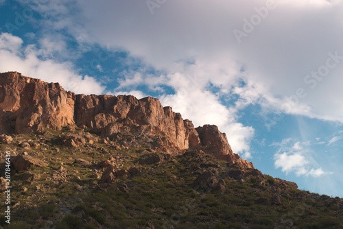 Rocky outcrop against a cloudy sky at sunset, in the province of Mendoza, Argentina.