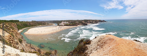 View from the cliffs to beach Praia de Odeceixe, West Coast Surfer Beach, Algarve Portugal photo