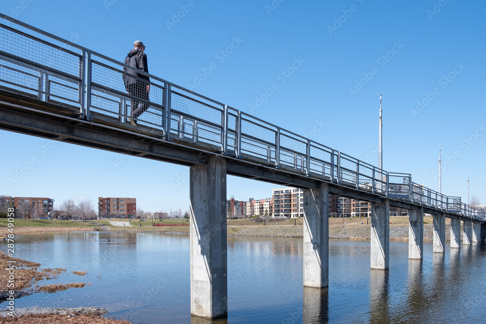 Man walking on a bridge