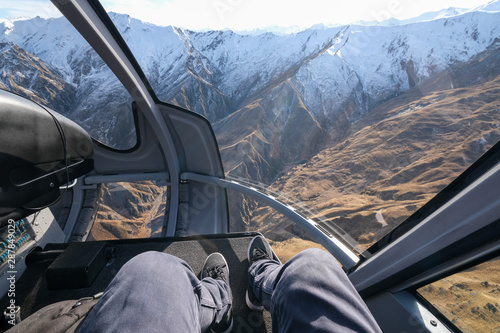 Helicopter ride over New zealand mountains