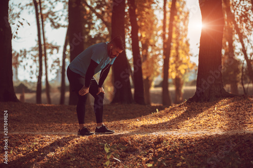 Adult man having rest after jogging.