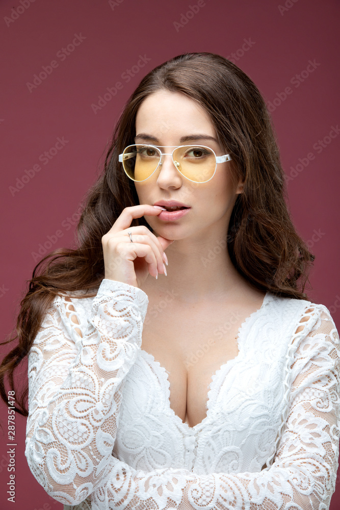 Portrait of a beautiful girl in glasses with a smile