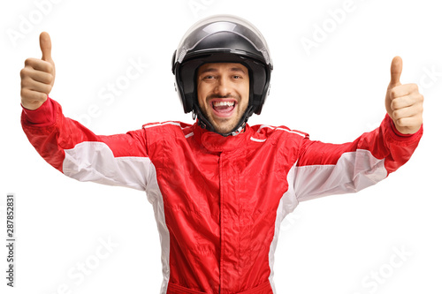 Cheerful racer with a helmet showing both thumbs up