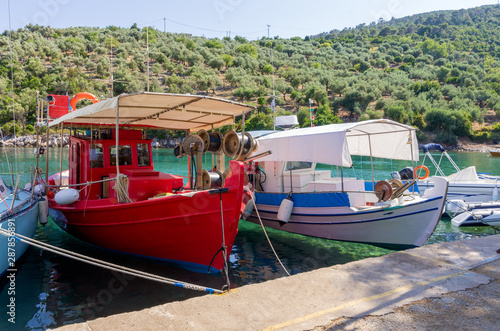 Fishing boats in the picturesque little harbor of Steni Vala village  Alonnisos island  Greece