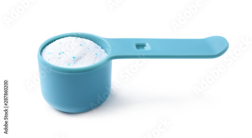 Measuring spoon with laundry powder isolated on white