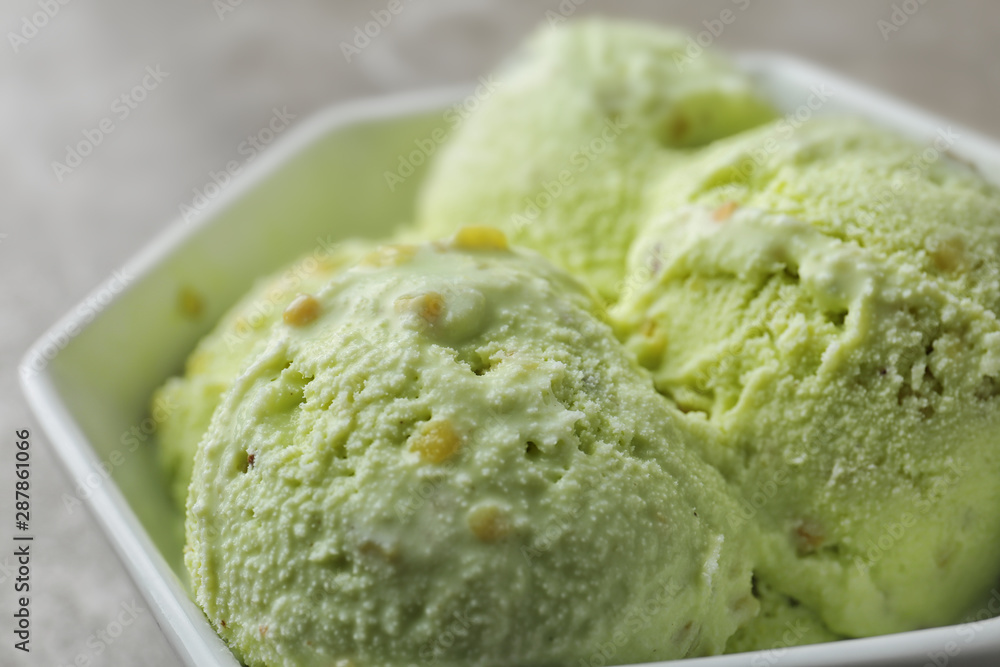 Delicious pistachio ice cream in bowl, closeup Delicious pistachio ice cream in bowl, closeup