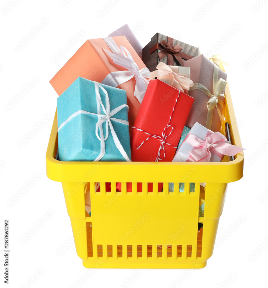 Fototapeta premium Shopping basket full of gift boxes on white background