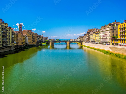 View of the Ponte Santa Trinita (Holy Trinity Bridge) and the Arno River. In Florence, Italy