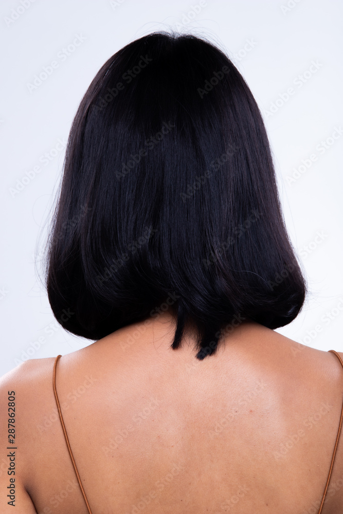 Fototapeta premium Back side view of Women to show short blonde curl Hair style before after applying hair styling, studio lighting gray background isolated, copy space for text logo