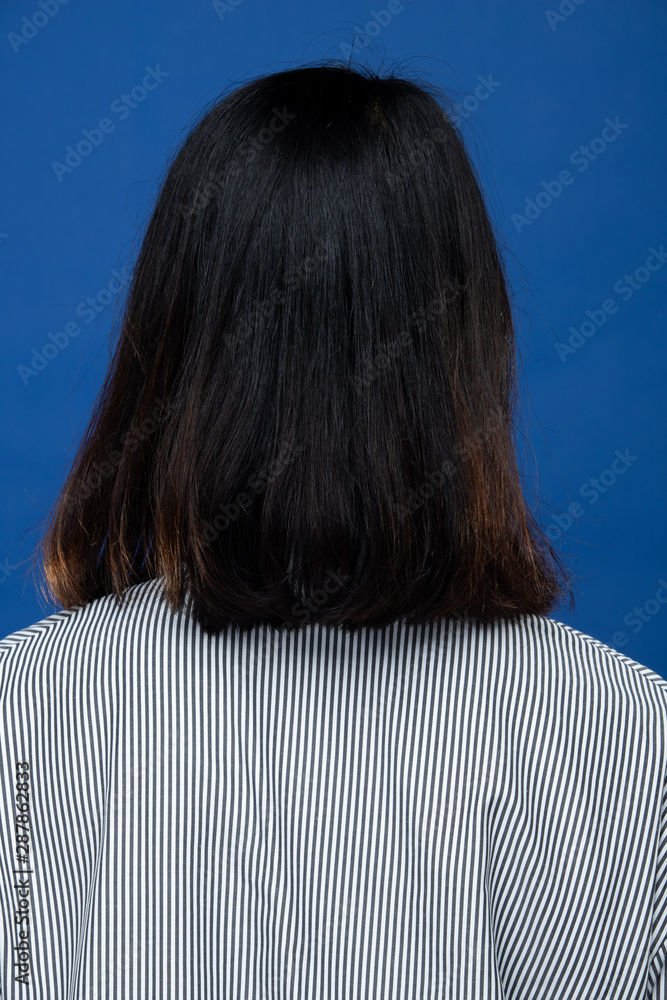 Back side view of Women to show short straight black Hair style before  after applying hair styling, studio lighting blue background isolated, copy  space for text logo Stock Photo | Adobe Stock