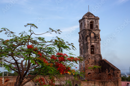 Beautiful View of a Church in a small touristic Cuban Town during a vibrant sunny sunrise. Taken in Trinidad, Cuba.