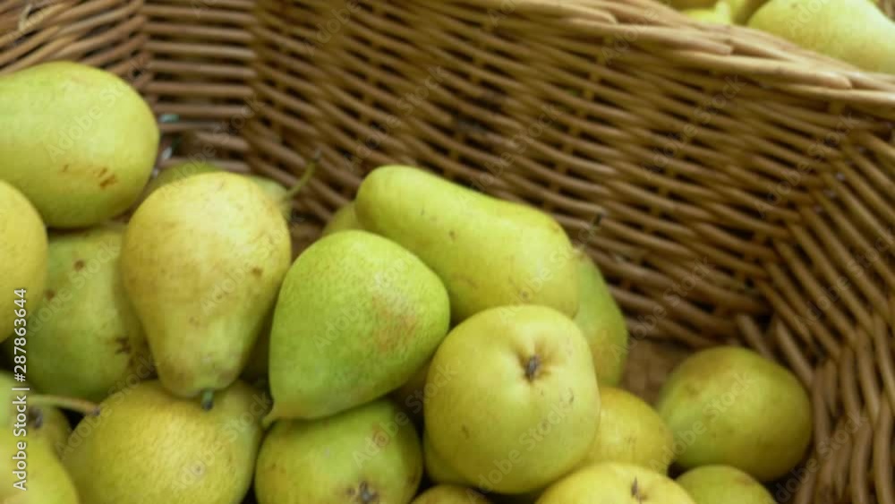 Fresh ripe pears background, pears on a counter in a supermarket. Fresh ripe pears background, pears on a counter in a supermarket.