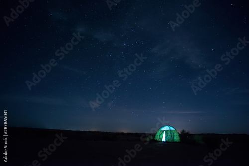 Camping tents under the stars at night