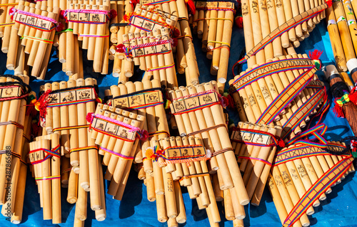  Traditional Andes pan flutes or panpipes on a market stall in Cusco, Peru. It is a traditional music instrument that can be found in Peru, Ecuador and Bolivia.