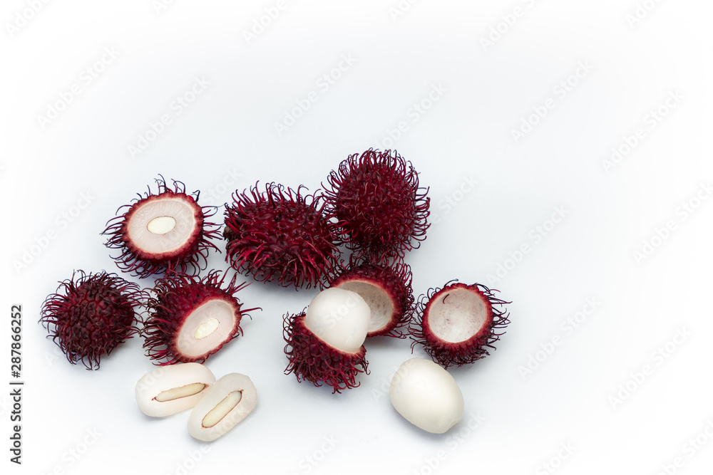 Naklejka premium Tropical exotic rambutan fruit, whole, half, cut, seed, flesh isolated on white background